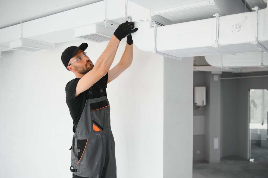 emergency hvac hvac technician at work. ventilation, heating system maintenance and repair.