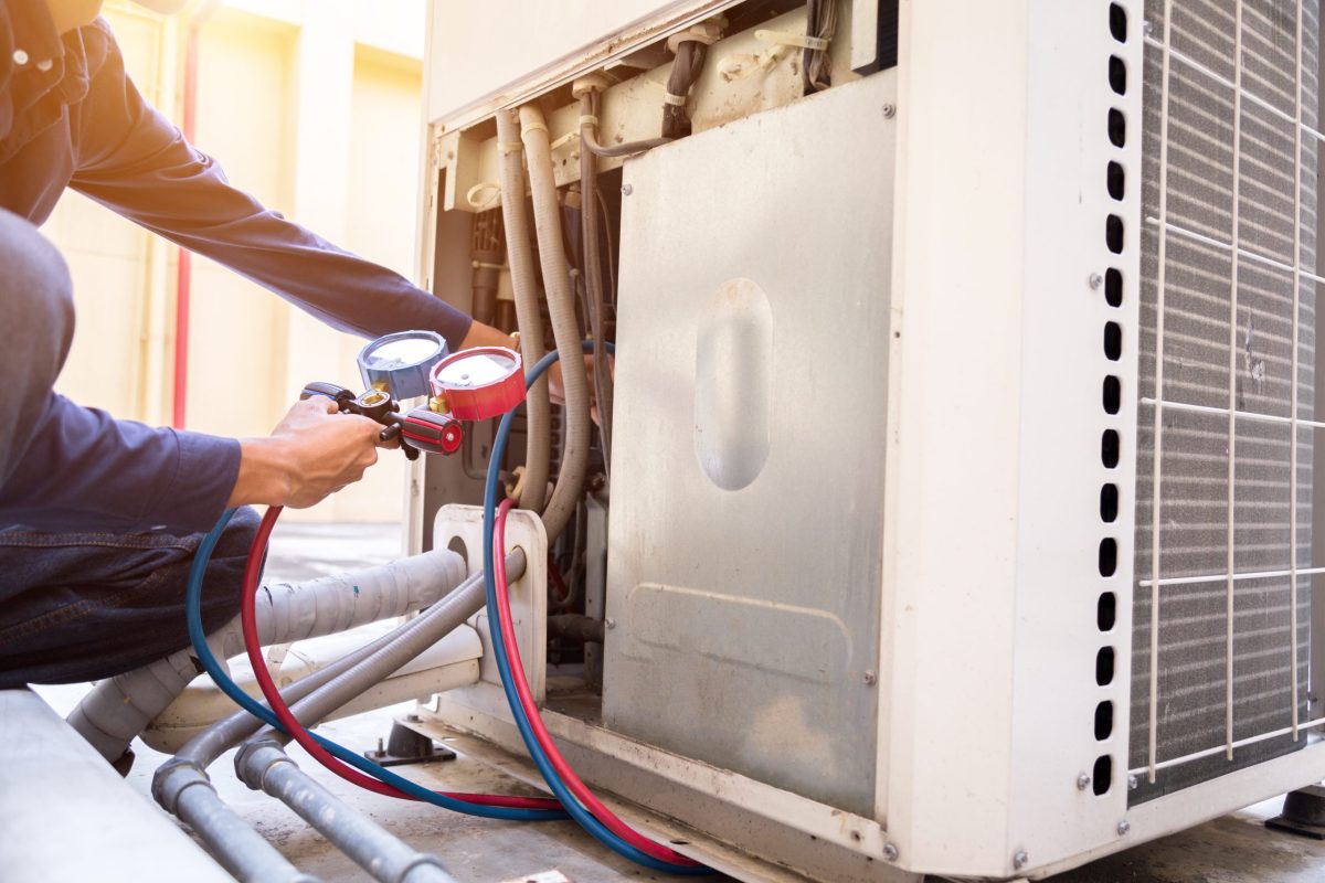 Technician is checking air conditioner ,measuring equipment for filling air conditioners. commercial hvac repair