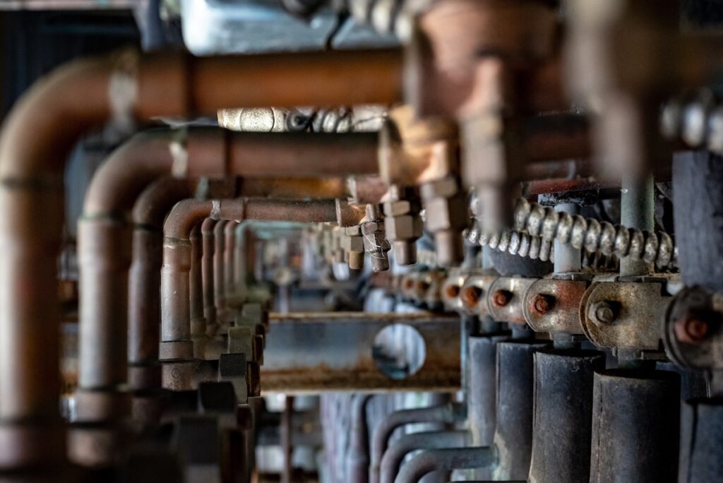 The weathered rusty refrigeration rack in a factory