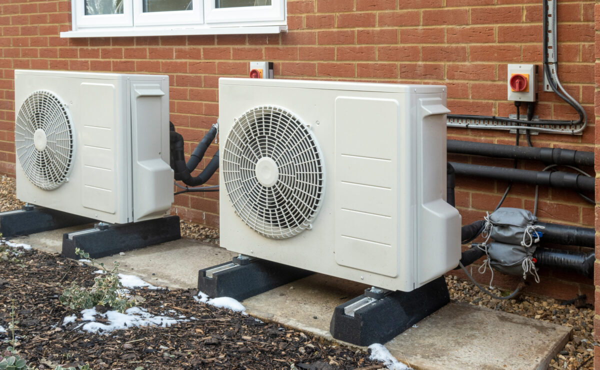 Two air source heat pump units installed on a modern house