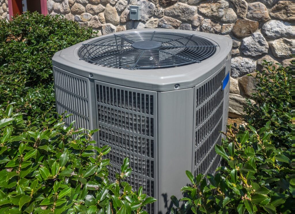 how to clean ac drain line Air conditioning and heating unit for a residential house hidden