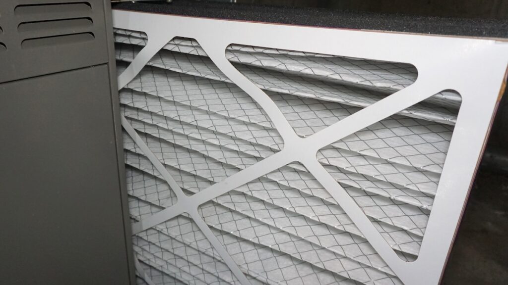 best furnace filters Installing a new, clean air filter in a residential furnace