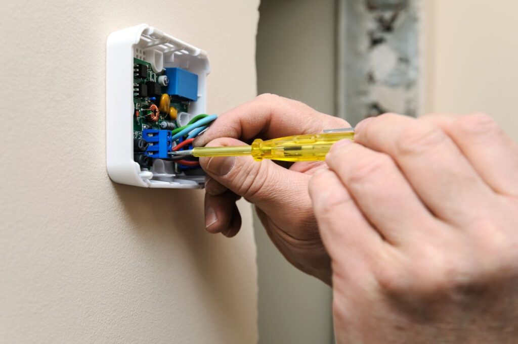 technician smart thermostat installation technician inside room