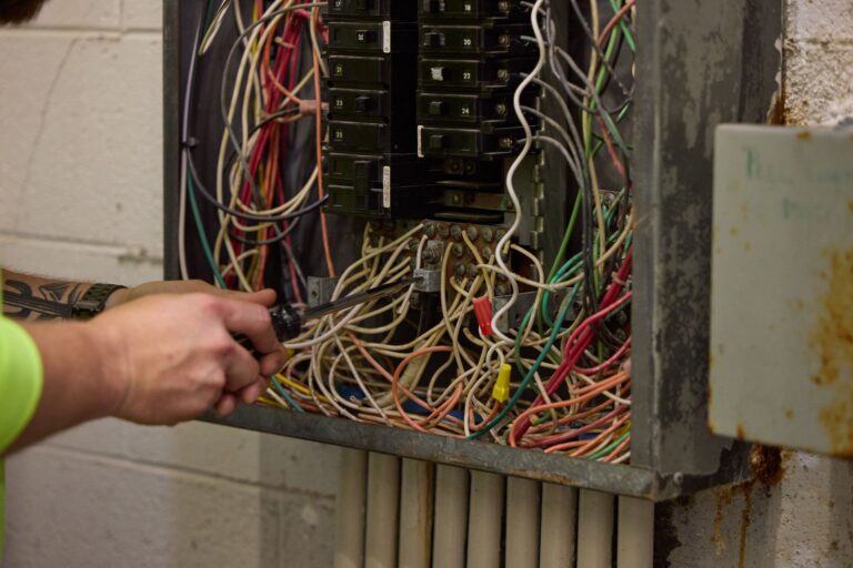 Hands fixing electrical cords