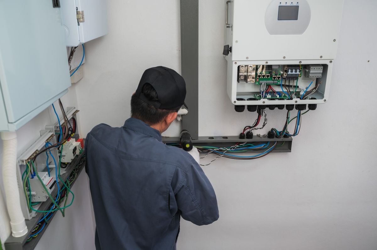 home generator installation worker installing box