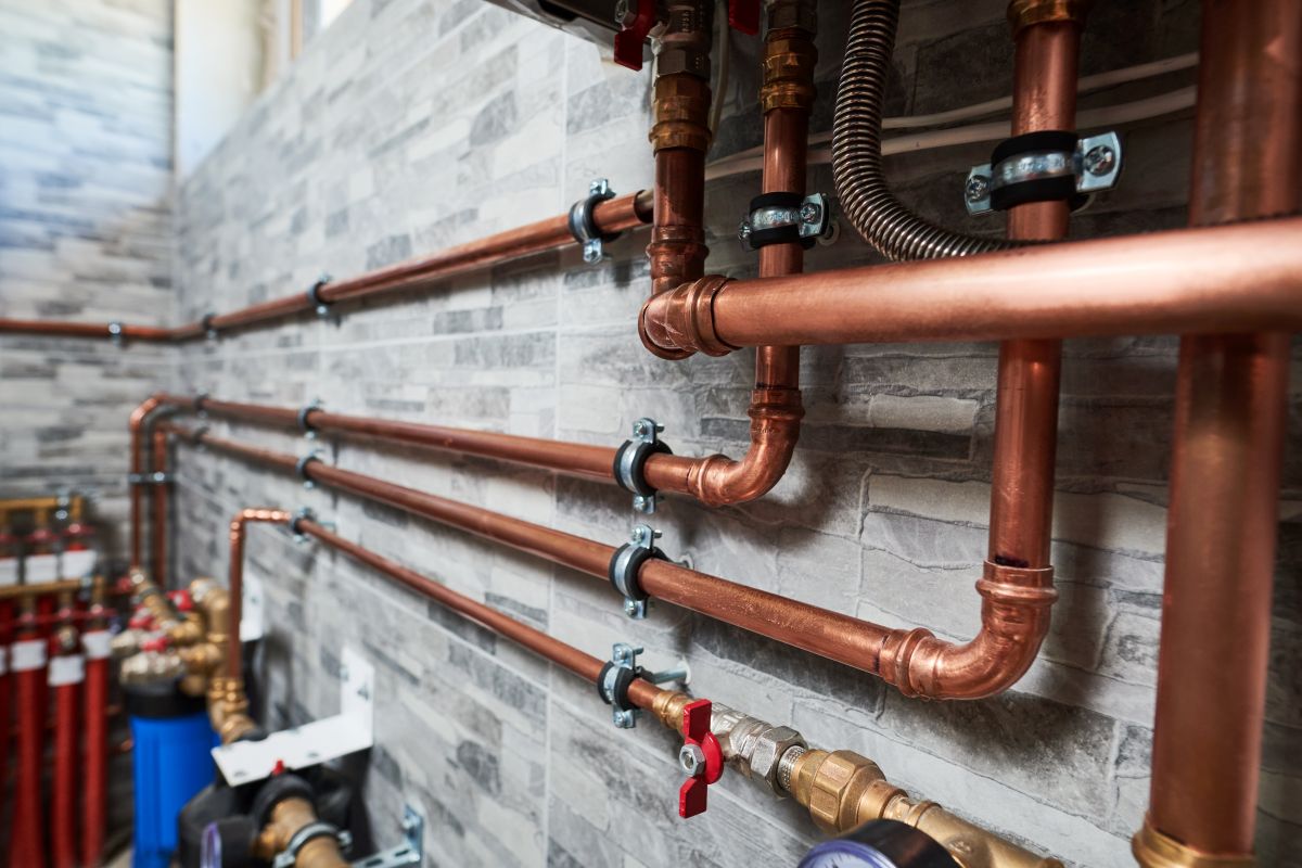 plumbing auburn hills copper pipes against wall