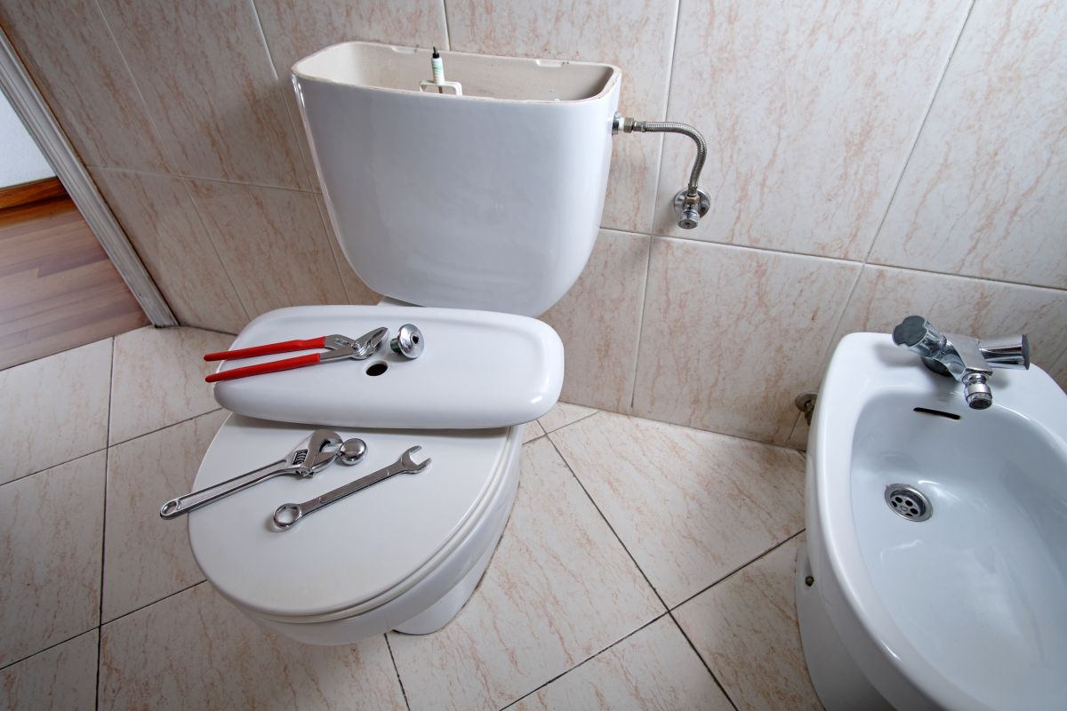 plumbing hartland tools on top of toilet