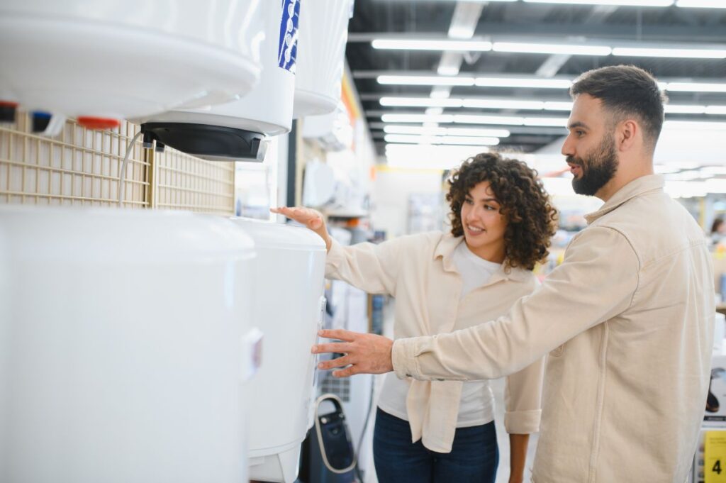 tankless water heater installation couple choosing unit inside store