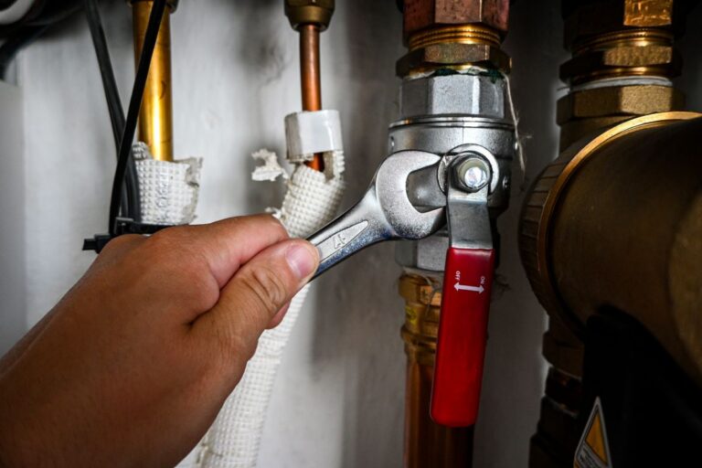 plumbing ann arbor hand adjusting pipes