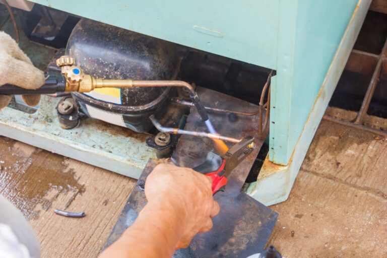 refrigeration davison hand holding tool to repair wires