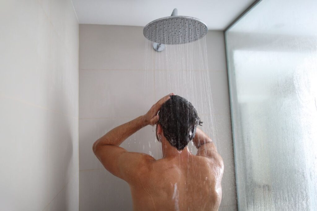 how to reduce humidity in house man having a hot shower