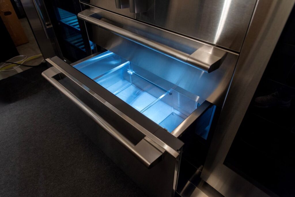 refrigeration system cabinet open with blue light