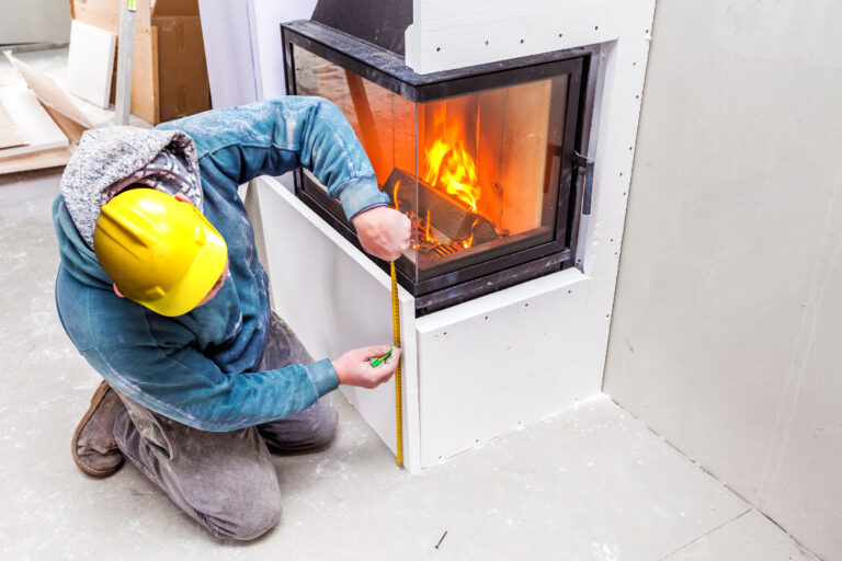 fireplace repair williamston mi worker installing new fireplace